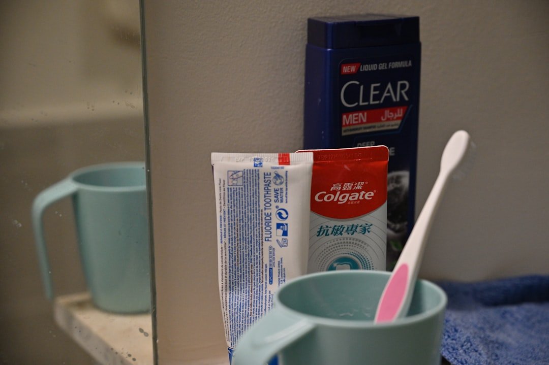 Toothbrush, toothpaste, and shampoo on bathroom counter