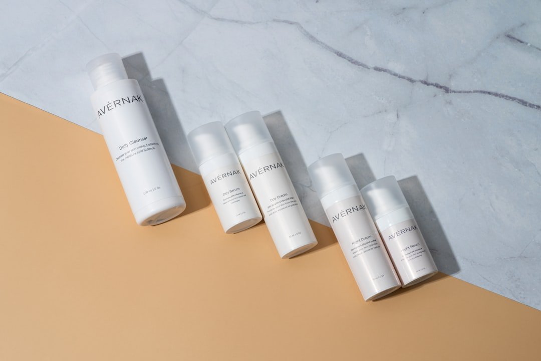 five bottles of skin care sitting on a counter